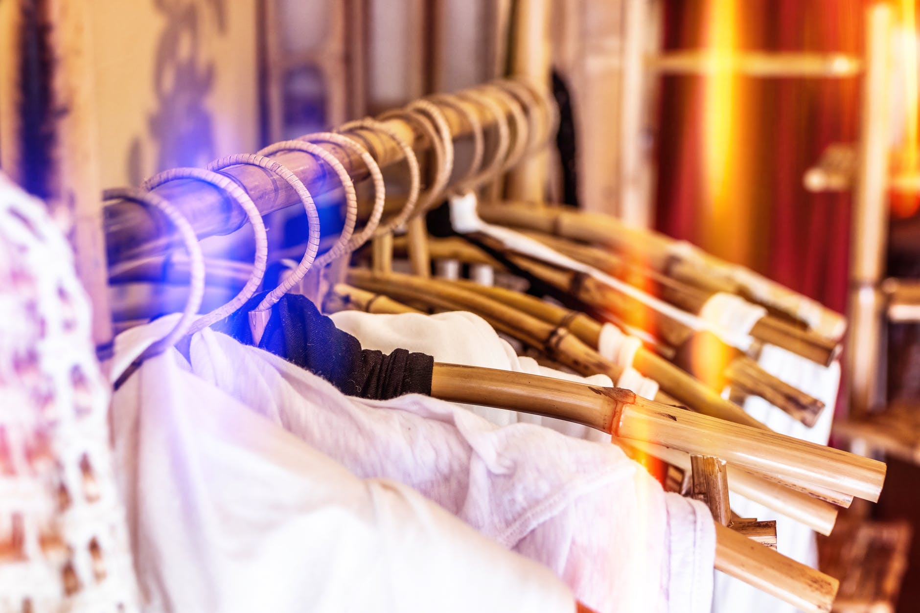 white clothes hanging on gray clothes hanger